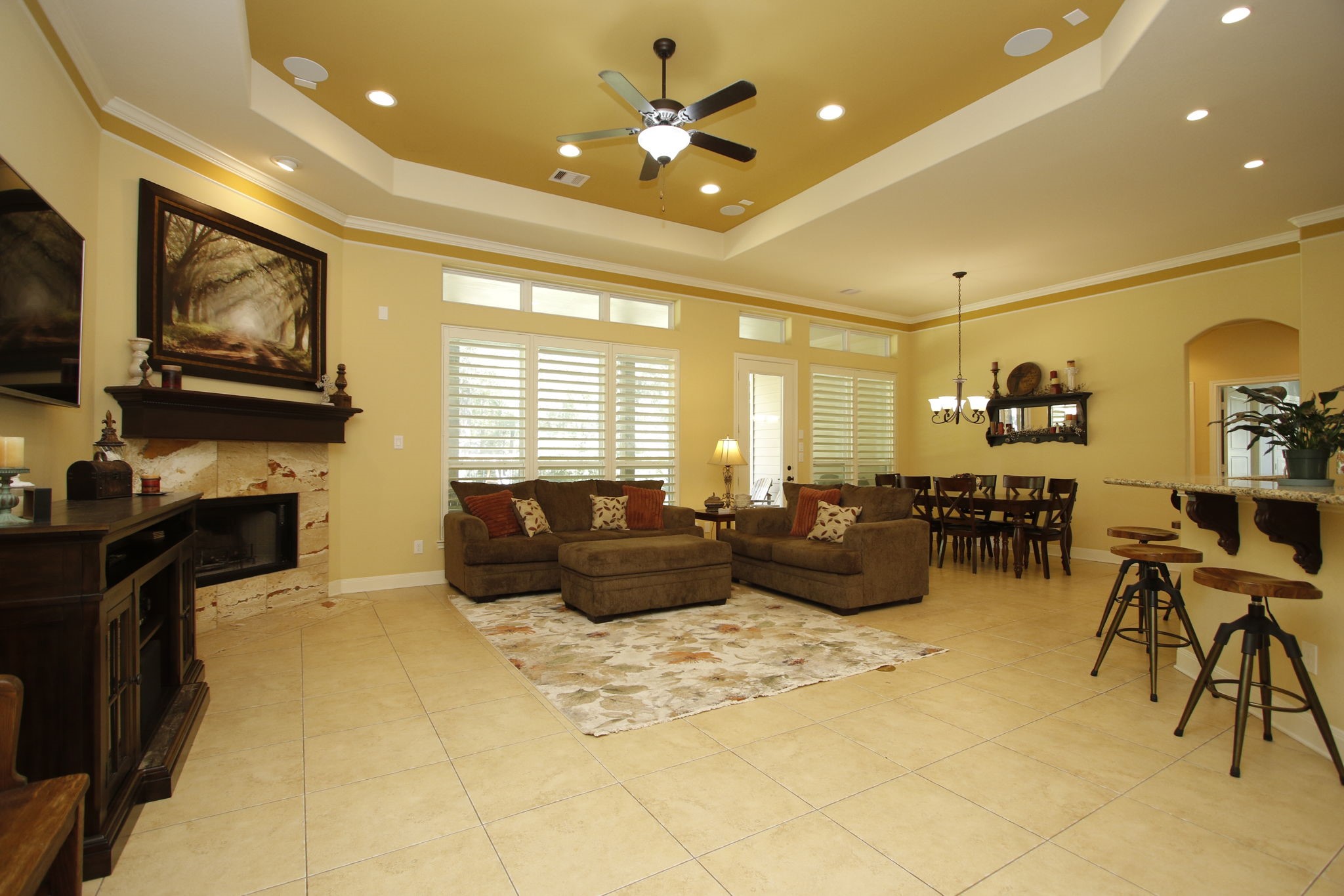 1547 Ruby Drive Willis, TX 77378 - Photo 11 of 48 a living room with furniture a flat screen tv and a fireplace