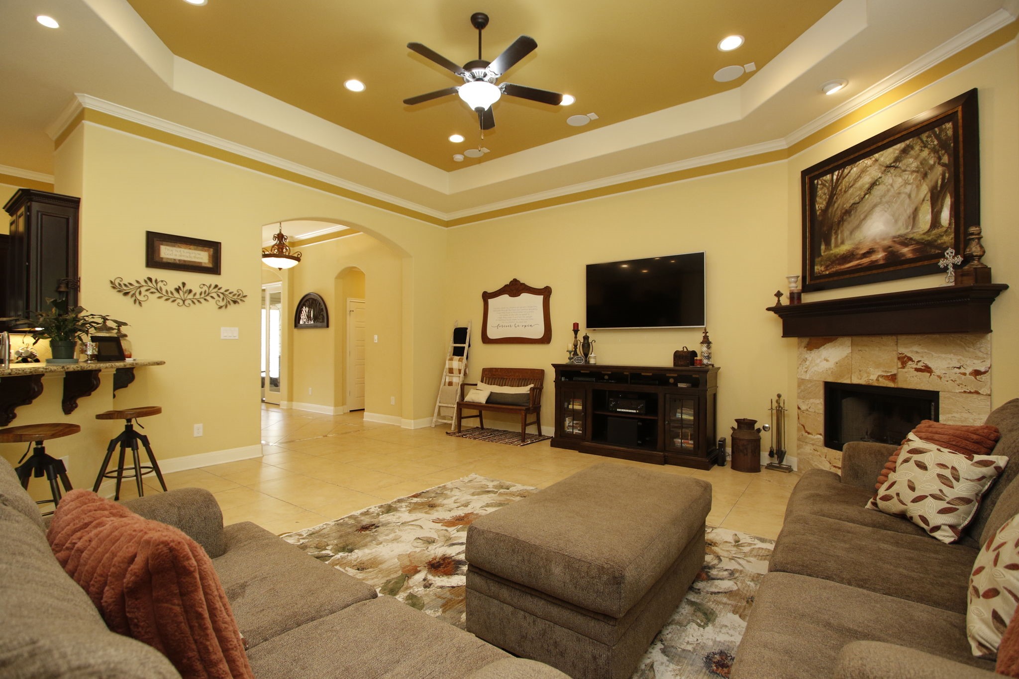 1547 Ruby Drive Willis, TX 77378 - Photo 12 of 48 a living room with furniture a fireplace and a flat screen tv