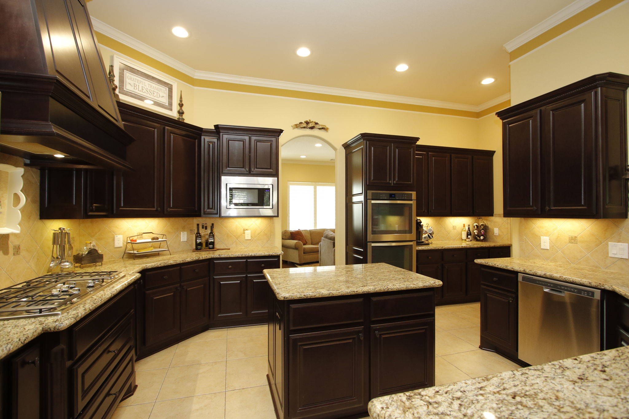 1547 Ruby Drive Willis, TX 77378 - Photo 15 of 48 a kitchen with granite countertop a sink cabinets and stainless steel appliances