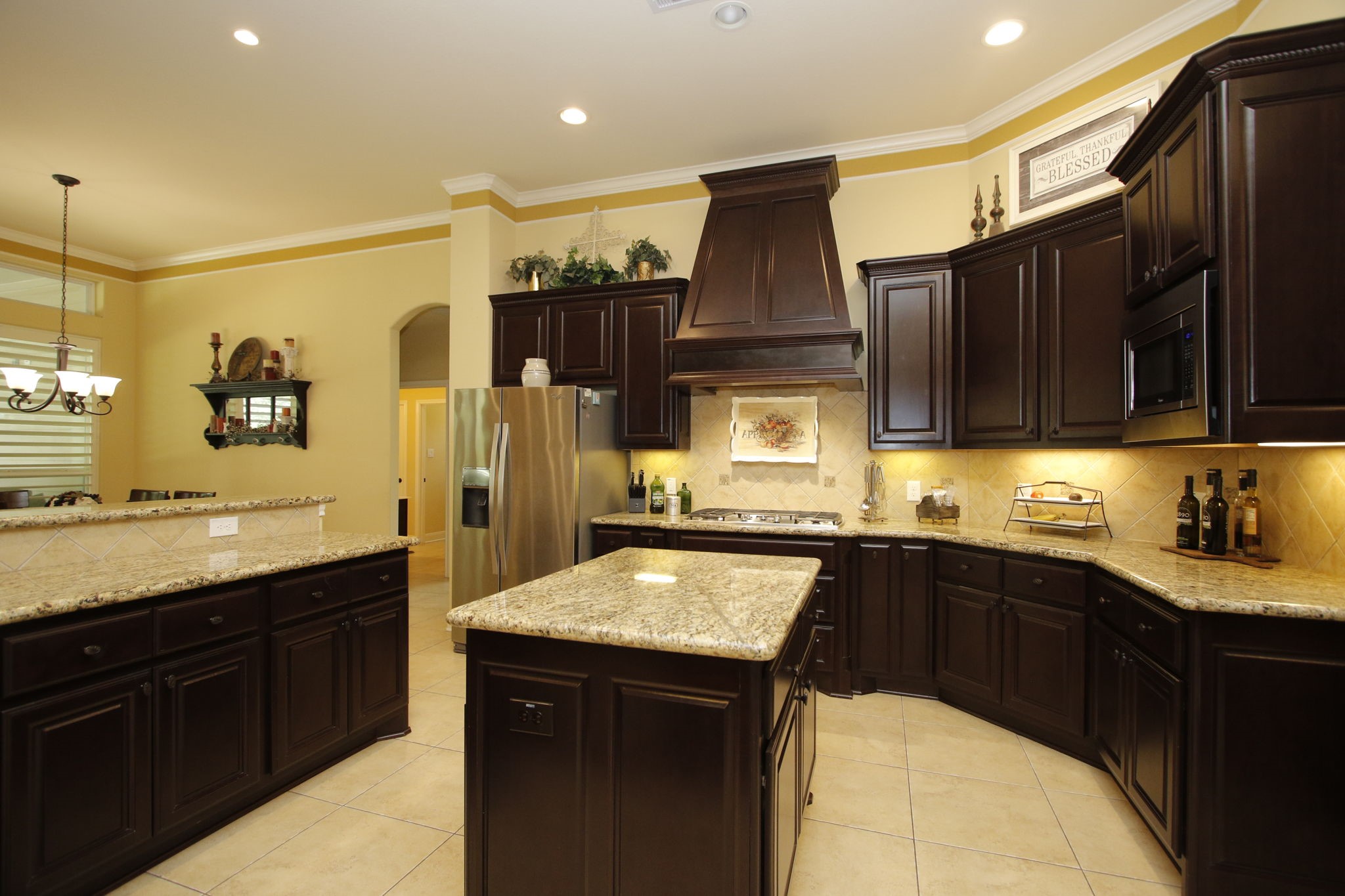 1547 Ruby Drive Willis, TX 77378 - Photo 16 of 48 a kitchen with a sink a stove and cabinets