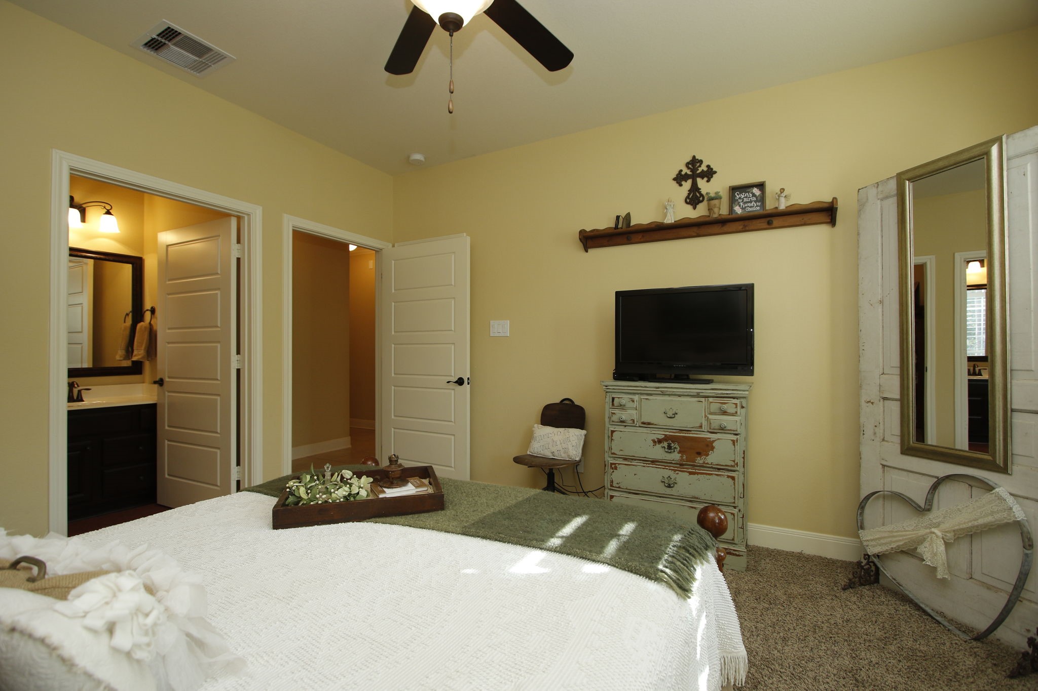 1547 Ruby Drive Willis, TX 77378 - Photo 21 of 48 a bedroom with a bed and a flat screen tv