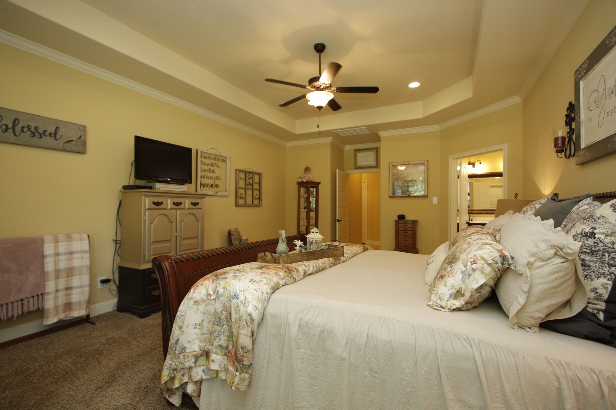 1547 Ruby Drive Willis, TX 77378 - Photo 24 of 48 a bedroom with bed and ceiling fan