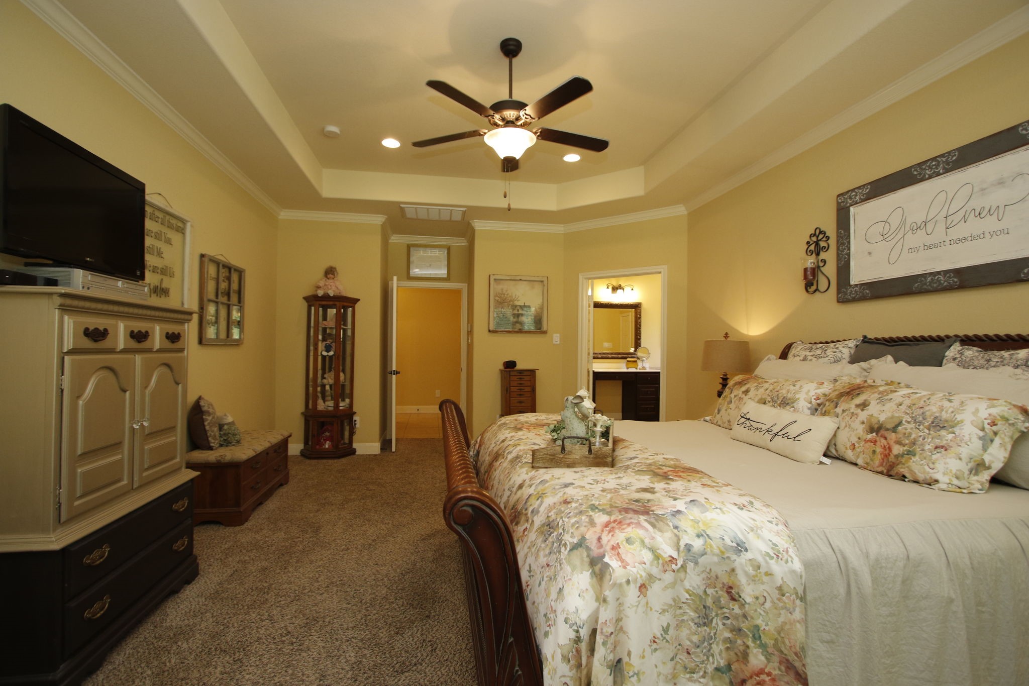 1547 Ruby Drive Willis, TX 77378 - Photo 25 of 48 a spacious bedroom with a bed and flat screen tv