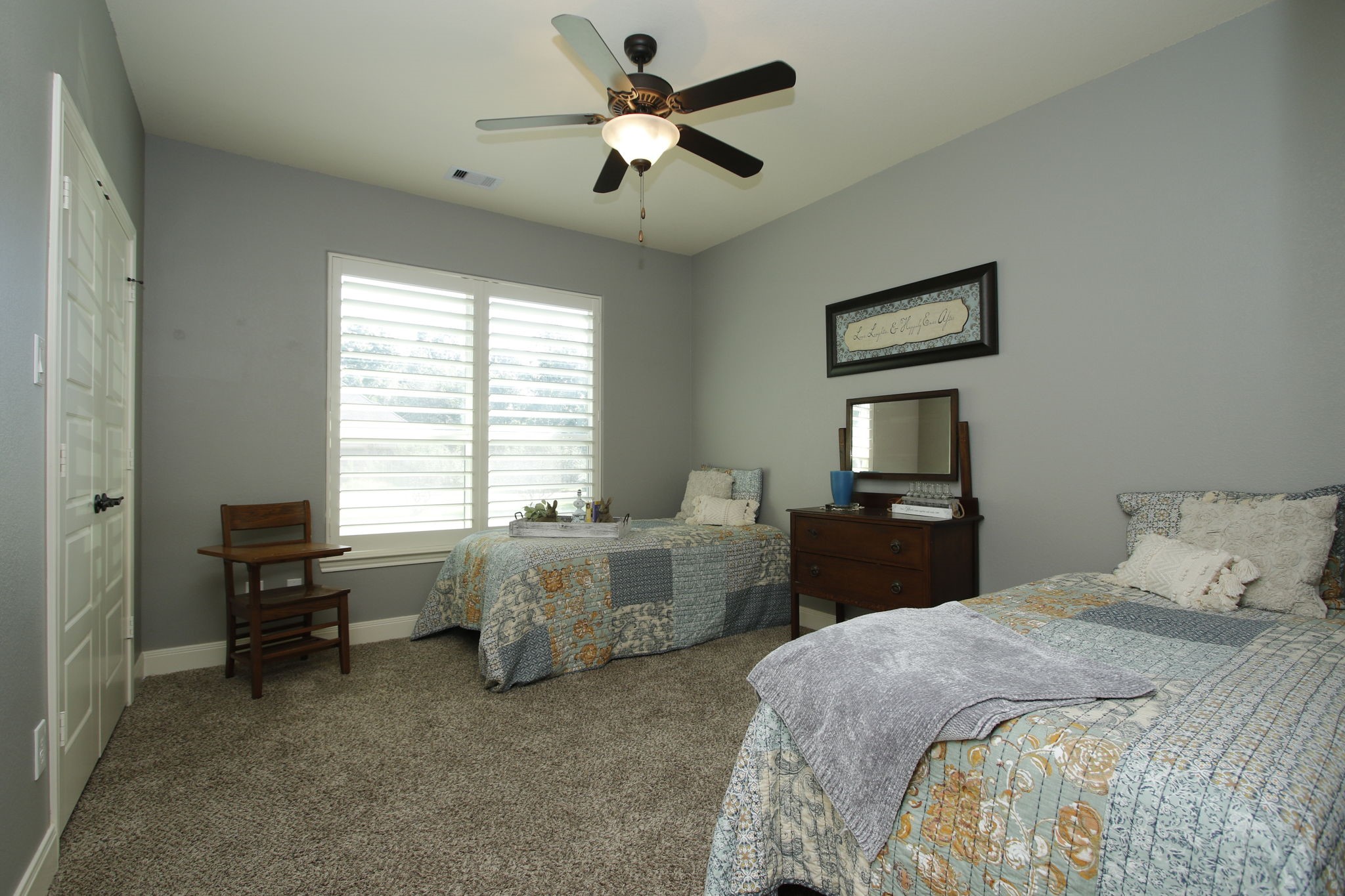 1547 Ruby Drive Willis, TX 77378 - Photo 29 of 48 a bedroom with a bed and a chandelier