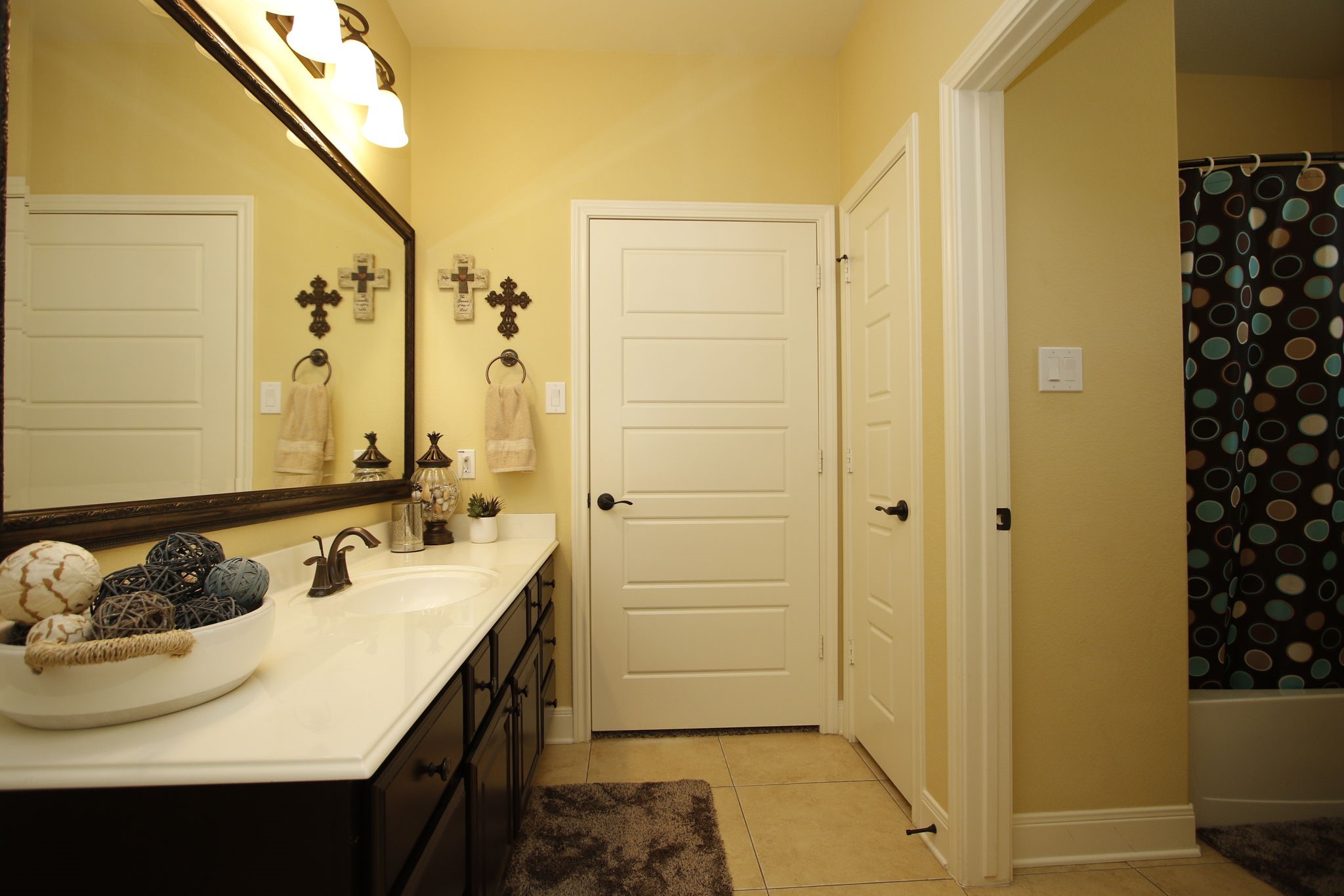 1547 Ruby Drive Willis, TX 77378 - Photo 31 of 48 a bathroom with a sink and a mirror