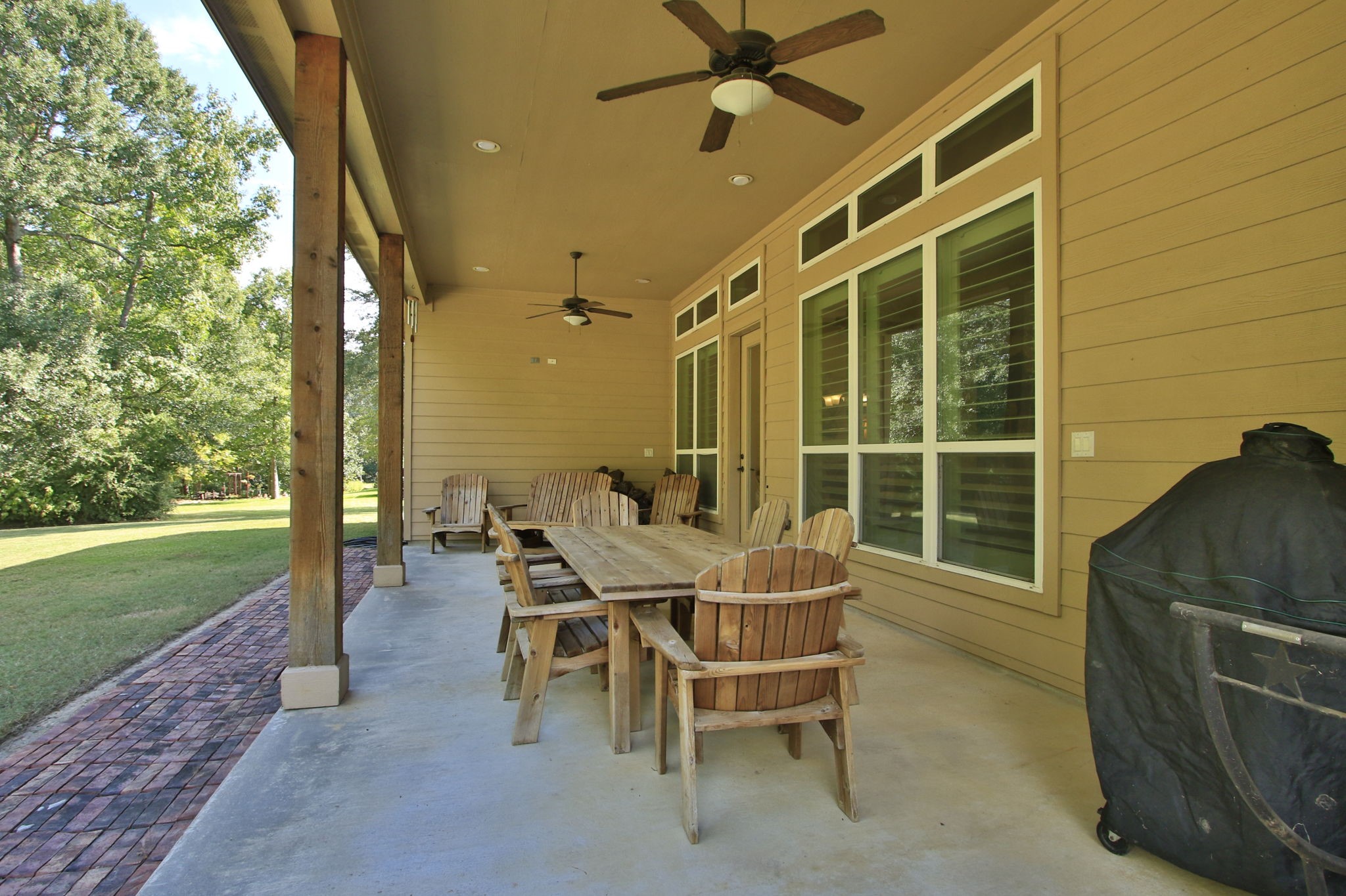1547 Ruby Drive Willis, TX 77378 - Photo 38 of 48 a patio with table and chairs and potted plants