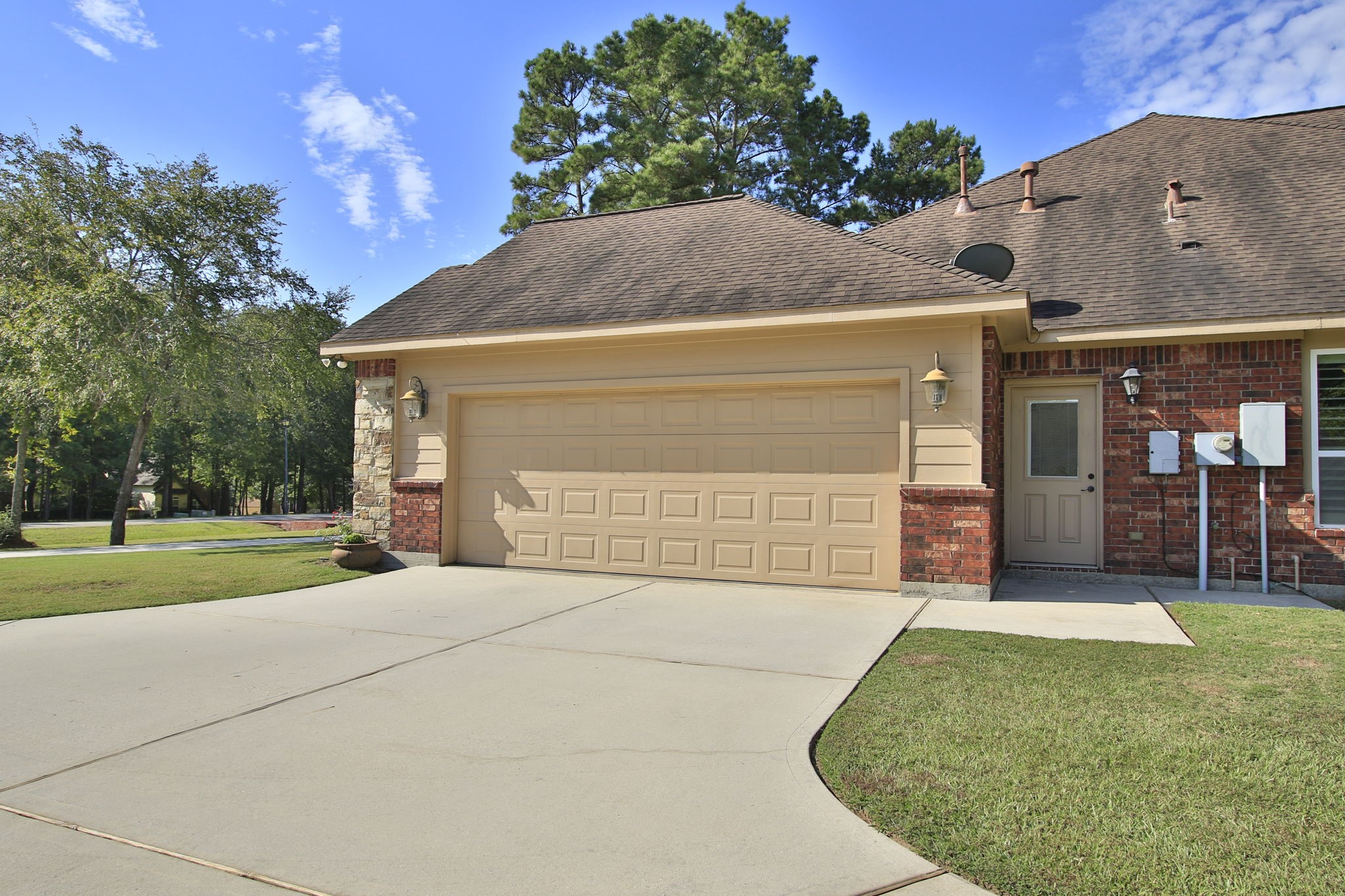 1547 Ruby Drive Willis, TX 77378 - Photo 48 of 48 a front view of a house with a yard and garage