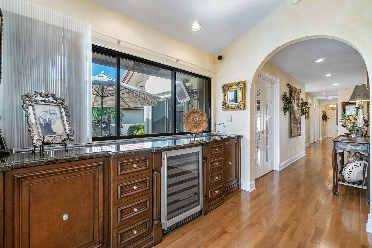 21772 Club Villa Terrace Boca Raton, FL 33433 - Photo 15 of 26 CUSTOM BAR OPENS TO PATIO AREA