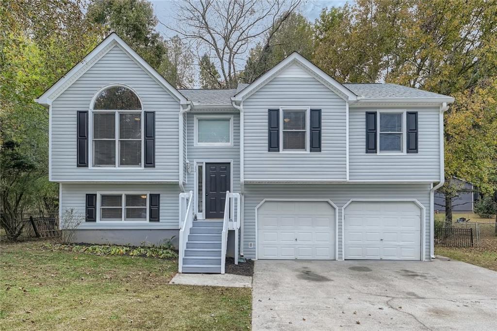 12 Villa Rosa Way Temple, GA 30179 - Photo 1 of 1 a front view of a house with a yard and garage