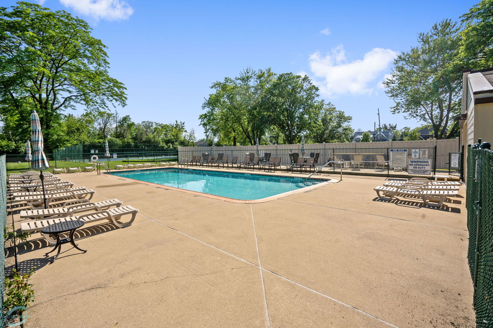 6401 Clarendon Hills Road, Unit 207 Willowbrook, IL 60527 - Photo 13 of 18 a view of outdoor space with swimming pool and sitting area