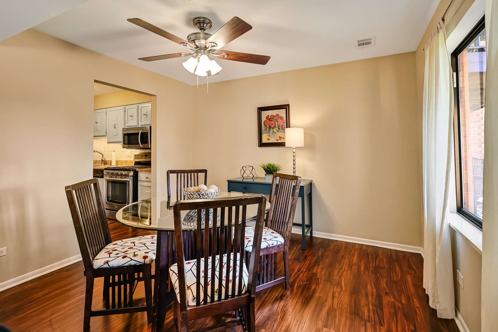 6401 Clarendon Hills Road, Unit 207 Willowbrook, IL 60527 - Photo 4 of 18 a view of a dining room with furniture and wooden floor