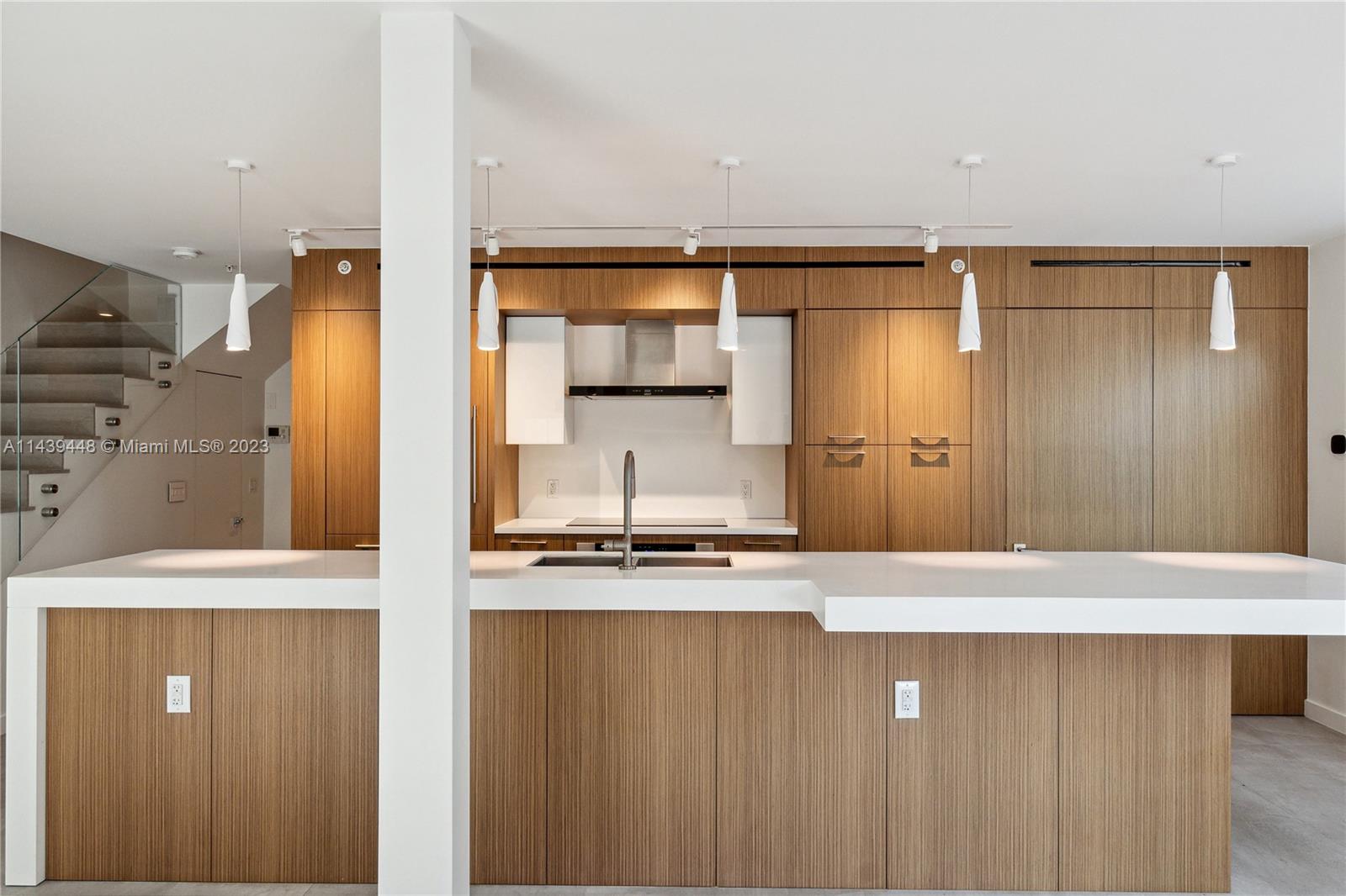 a view of a kitchen with a sink