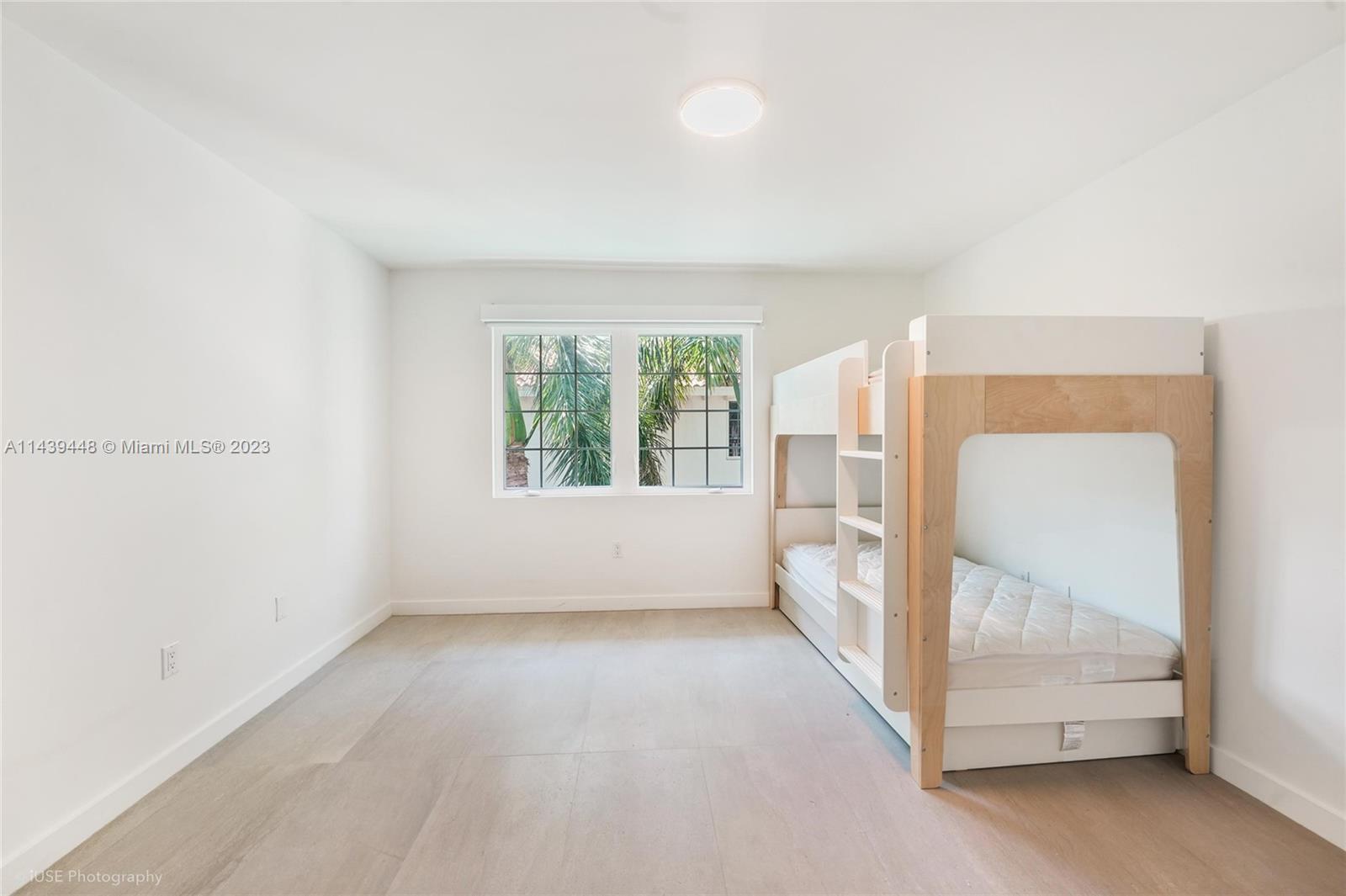 730 3rd Street, Unit 207 Miami Beach, FL 33139 - Photo 12 of 19 a view of an empty room with a window
