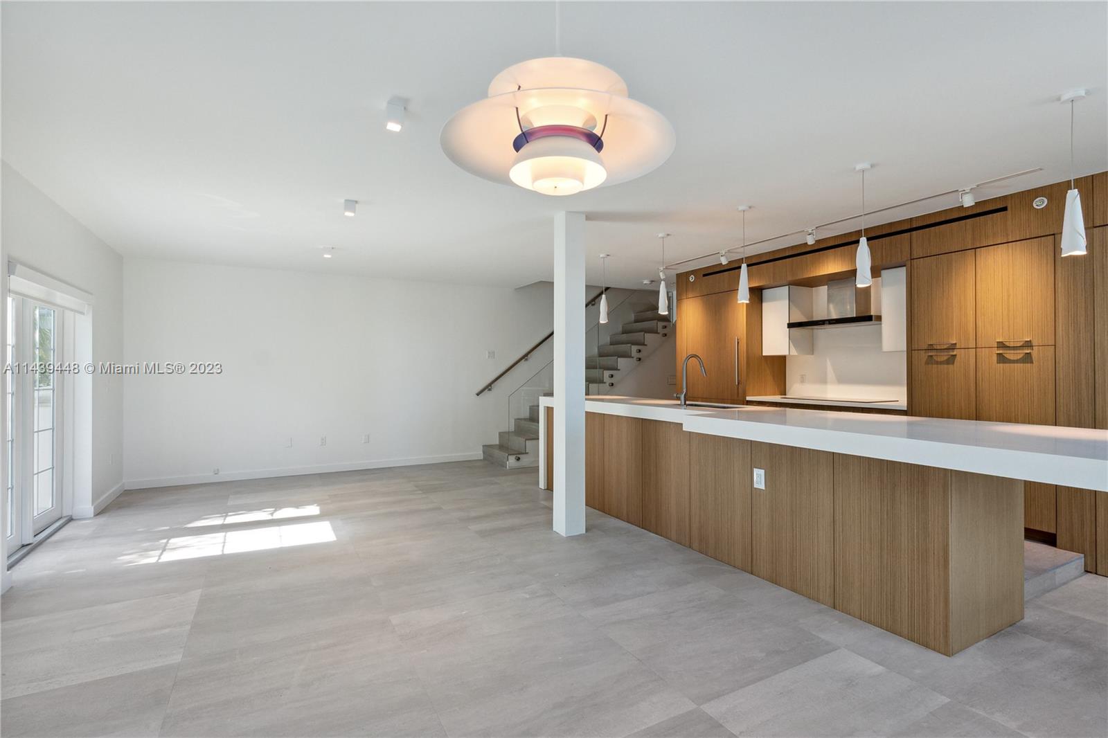 730 3rd Street, Unit 207 Miami Beach, FL 33139 - Photo 5 of 19 a view of a kitchen with a sink and cabinets