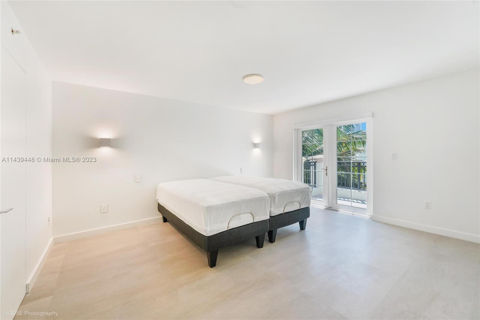 730 3rd Street, Unit 207 Miami Beach, FL 33139 - Photo 9 of 19 a spacious bedroom with a bed and a window