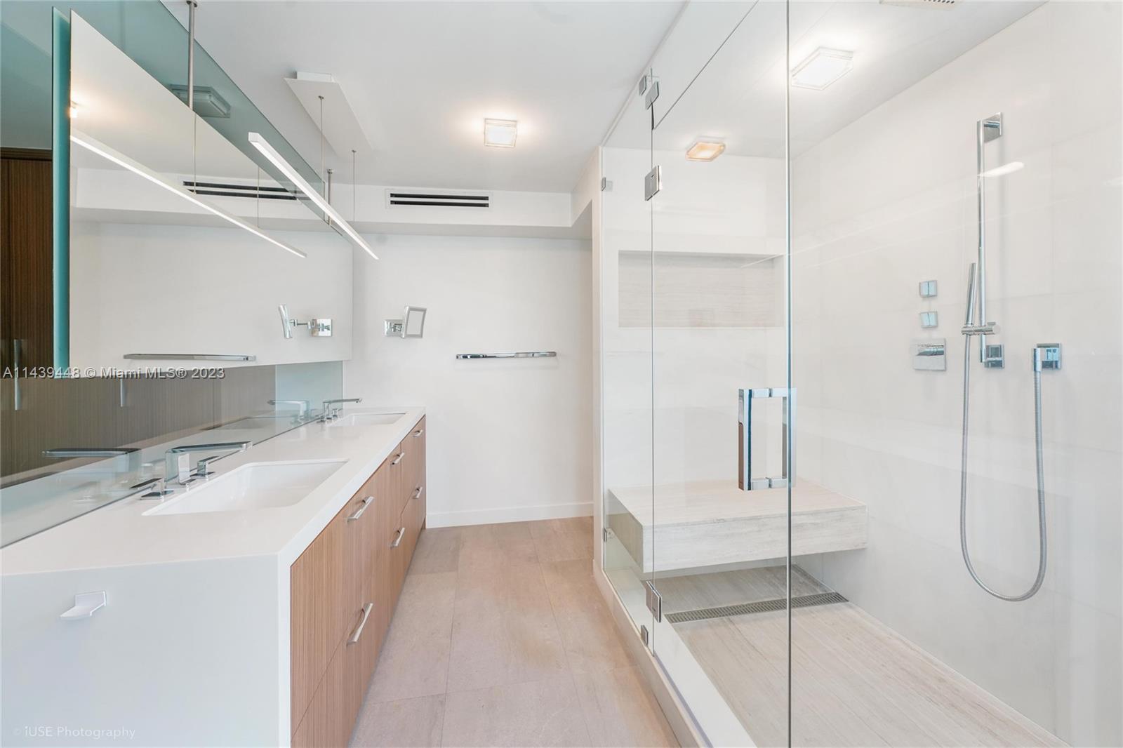 730 3rd Street, Unit 207 Miami Beach, FL 33139 - Photo 10 of 19 a bathroom with a tub sink and mirror