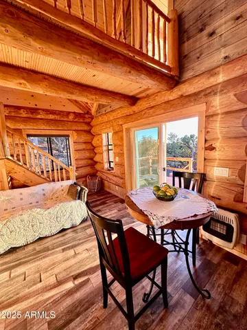 a view of a dining table and chairs in the patio