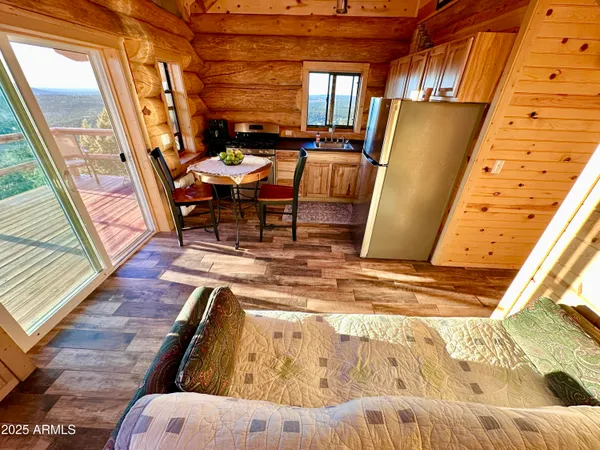 a view of a living room with furniture and a fireplace