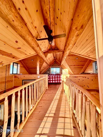 a view of an chairs and table on the balcony