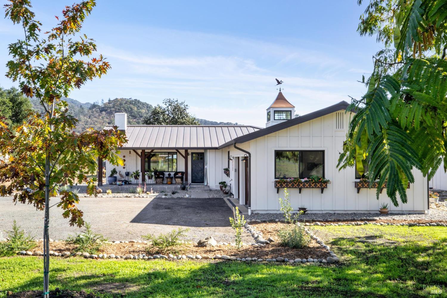 180 Adobe Canyon Road Kenwood, CA 95452 - Photo 1 of 1 a front view of a house with garden