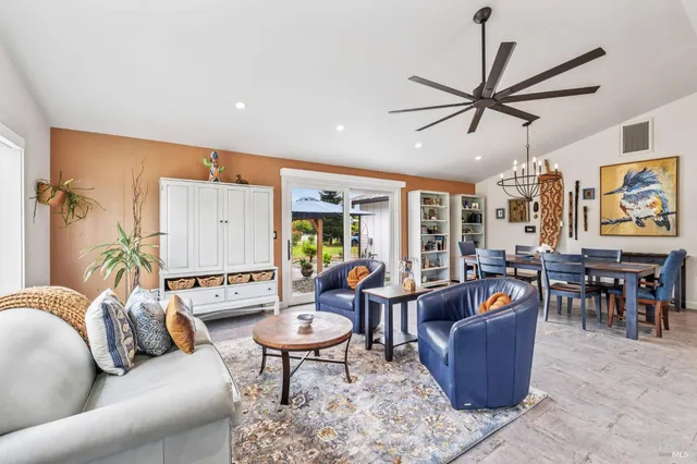 a view of a dining room with furniture window and outside view