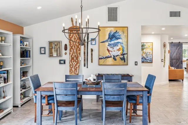 a kitchen with counter top space and living room