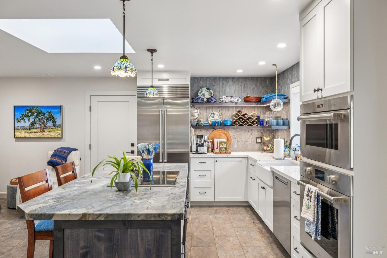 180 Adobe Canyon Road Kenwood, CA 95452 - Photo 21 of 61 a kitchen with white cabinets and sink