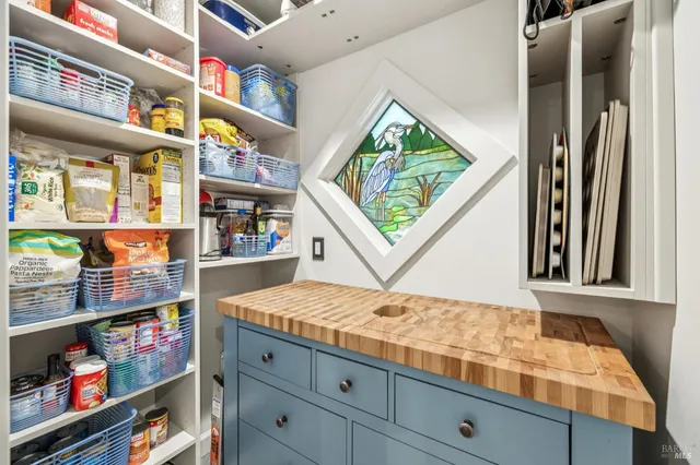 a front view of a house with white walls