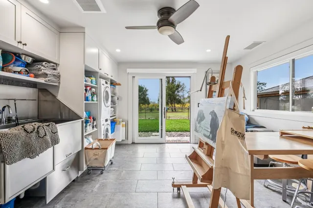 a bathroom with a double vanity sink and mirror