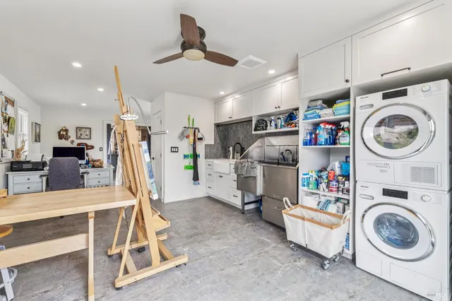 a bathroom with a double vanity sink mirror and shower