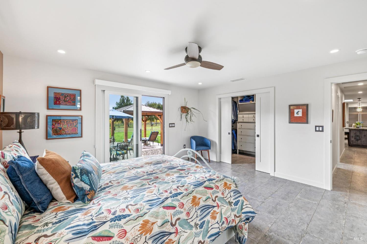180 Adobe Canyon Road Kenwood, CA 95452 - Photo 35 of 61 a bedroom with a bed and glass windows