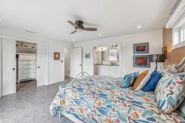 a bathroom with a granite countertop sink a mirror a shower and a bathtub