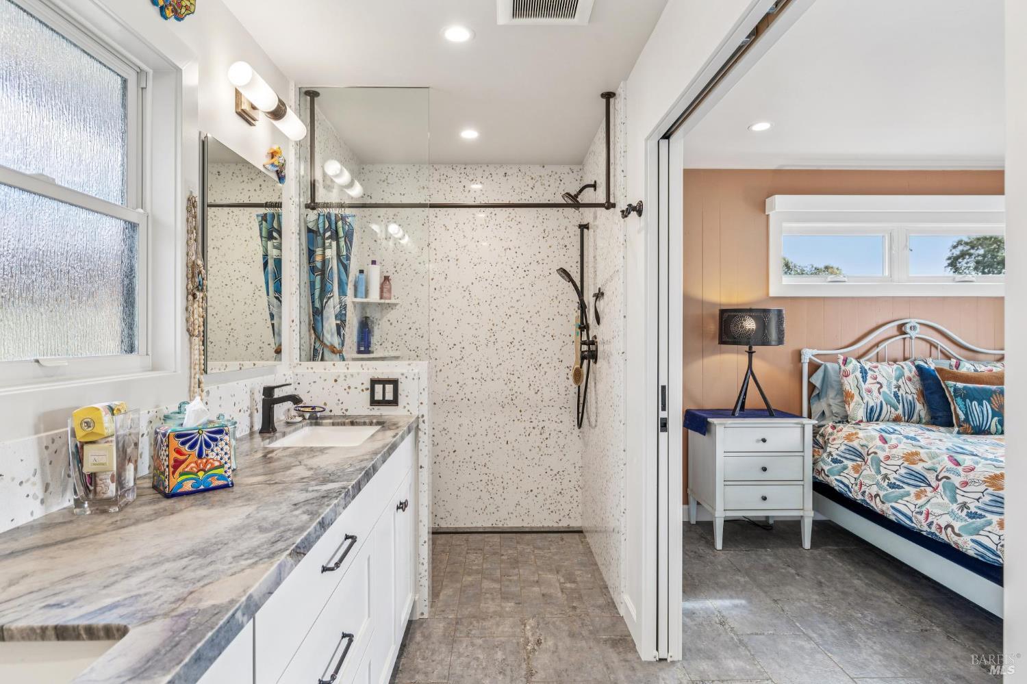 180 Adobe Canyon Road Kenwood, CA 95452 - Photo 38 of 61 a bathroom with a double vanity sink mirror and shower