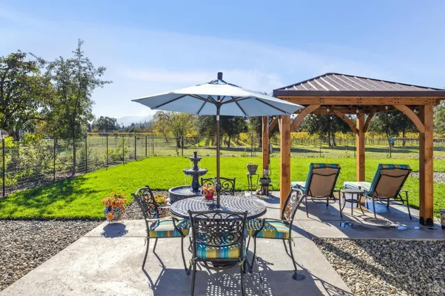 a front view of a house with a yard and porch