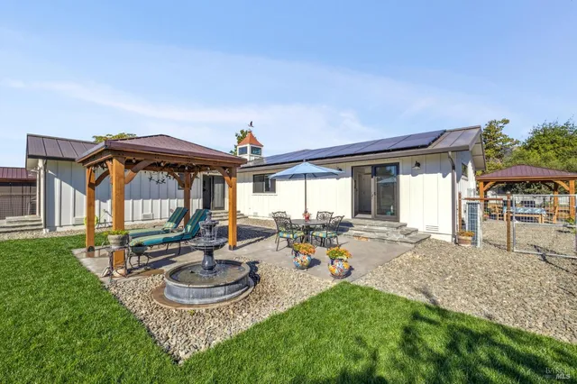 an aerial view of a house with a garden