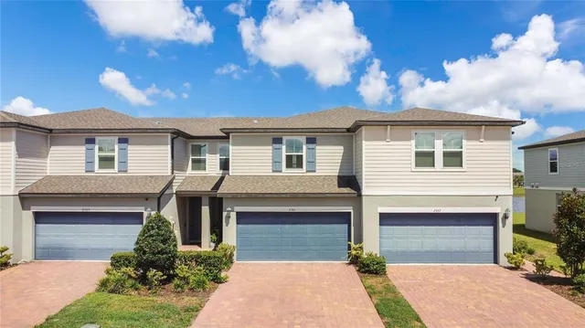 a front view of a house with yard