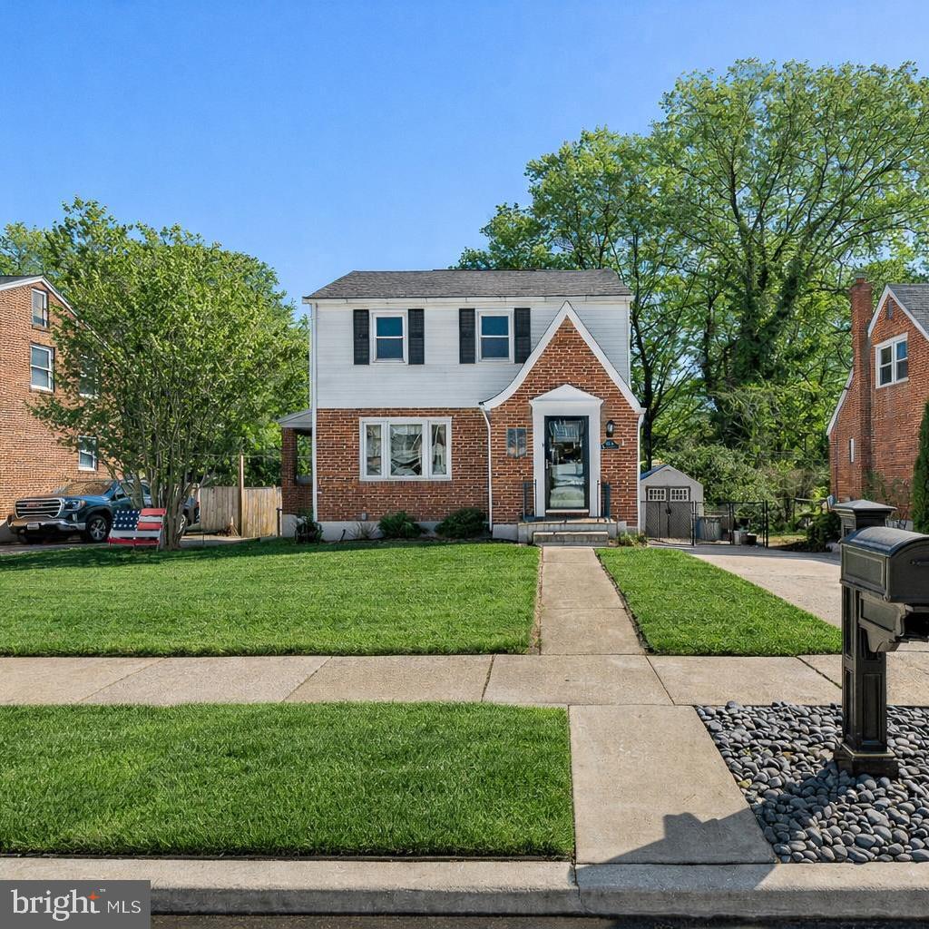 8109 Woodhaven Road Baltimore, MD 21237 - Photo 1 of 40 a front view of a house with a yard