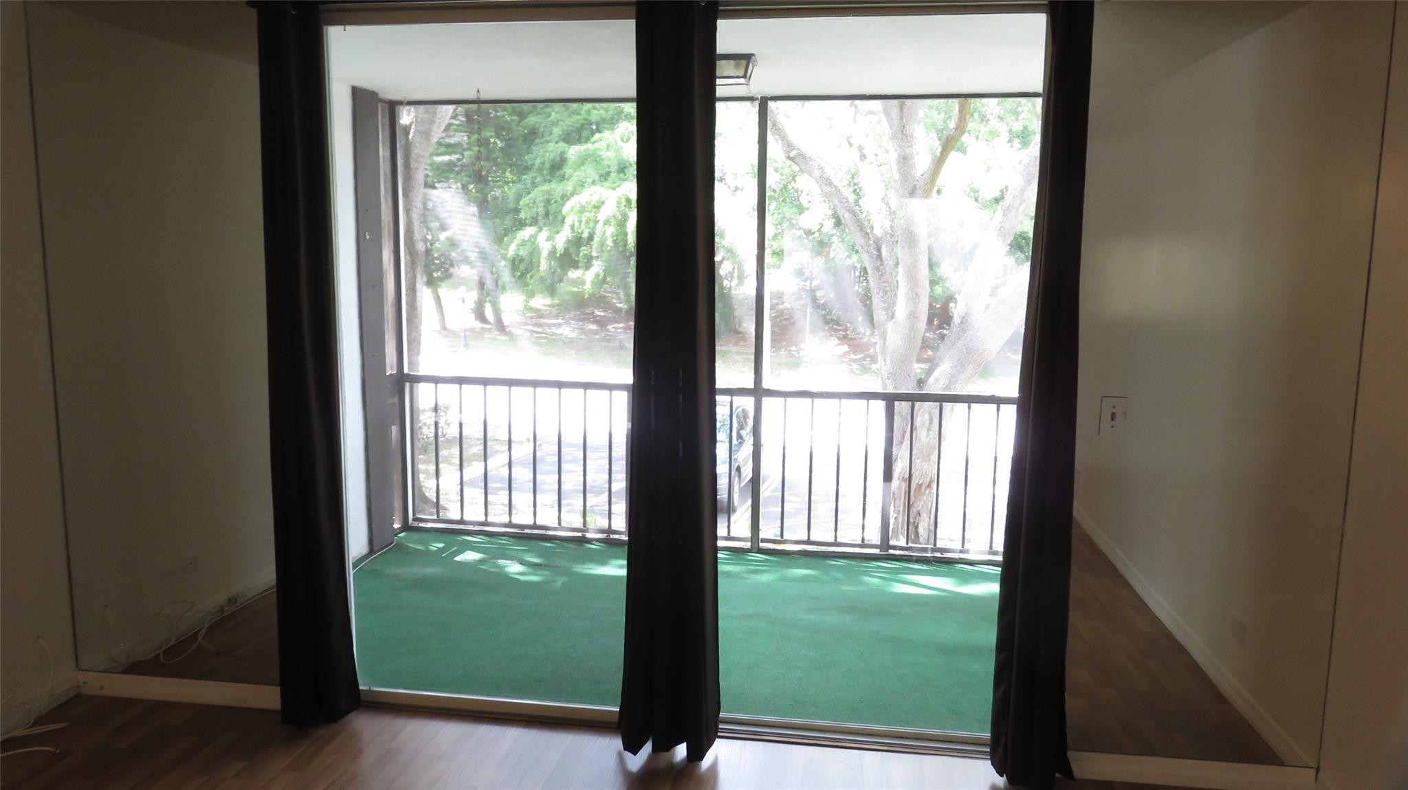 3720 Inverrary Drive, Unit 2C Lauderhill, FL 33319 - Photo 13 of 42 a view of a back yard from a room with a large window