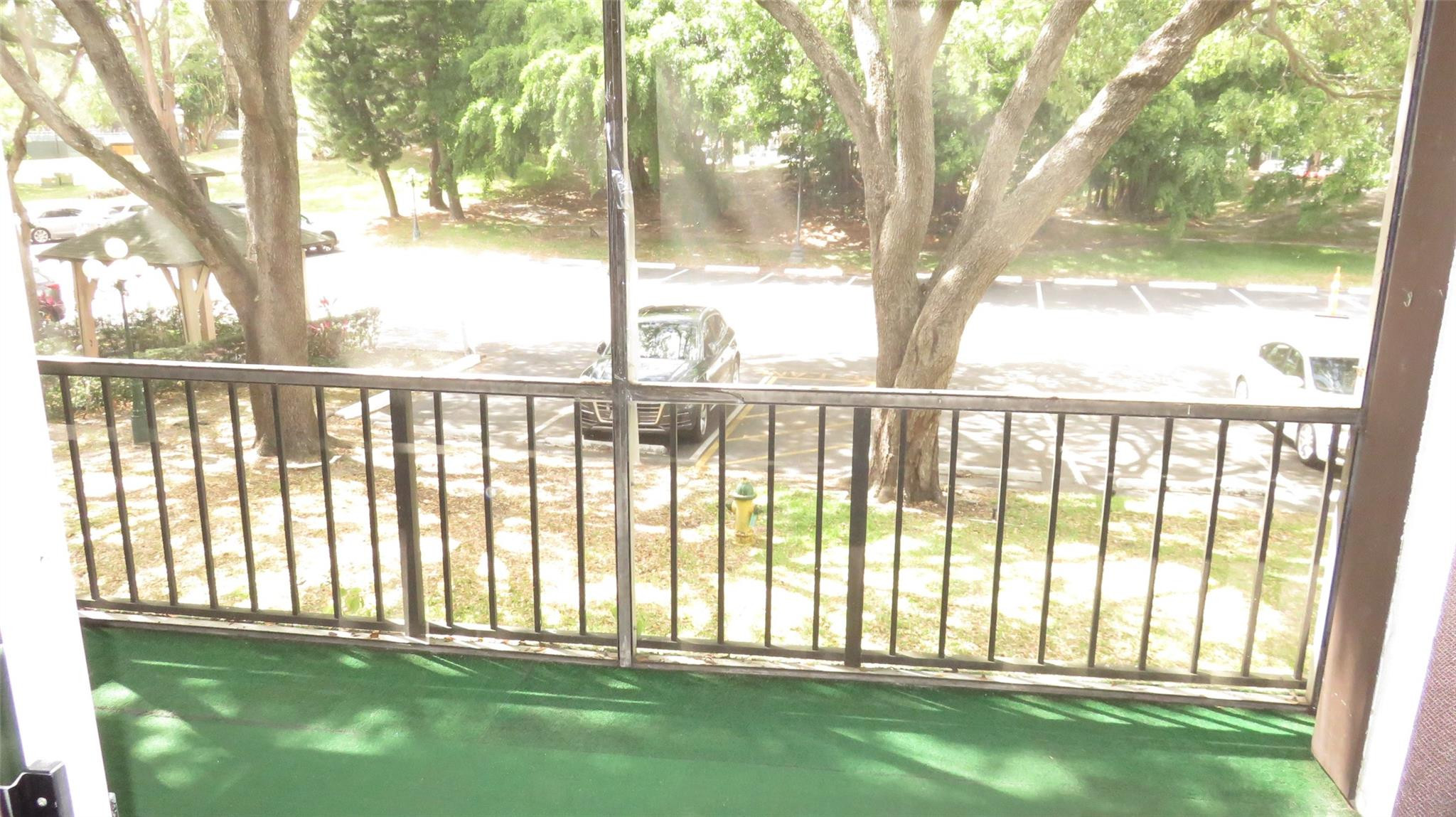 3720 Inverrary Drive, Unit 2C Lauderhill, FL 33319 - Photo 14 of 42 a view of outdoor space with deck and a yard