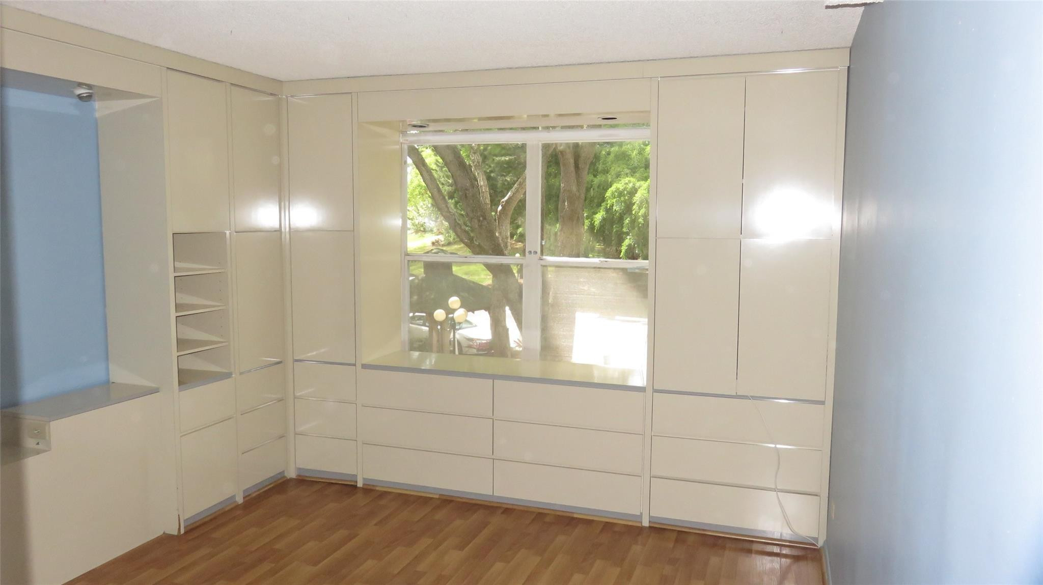 3720 Inverrary Drive, Unit 2C Lauderhill, FL 33319 - Photo 19 of 42 a view of empty room with wooden floor and fan
