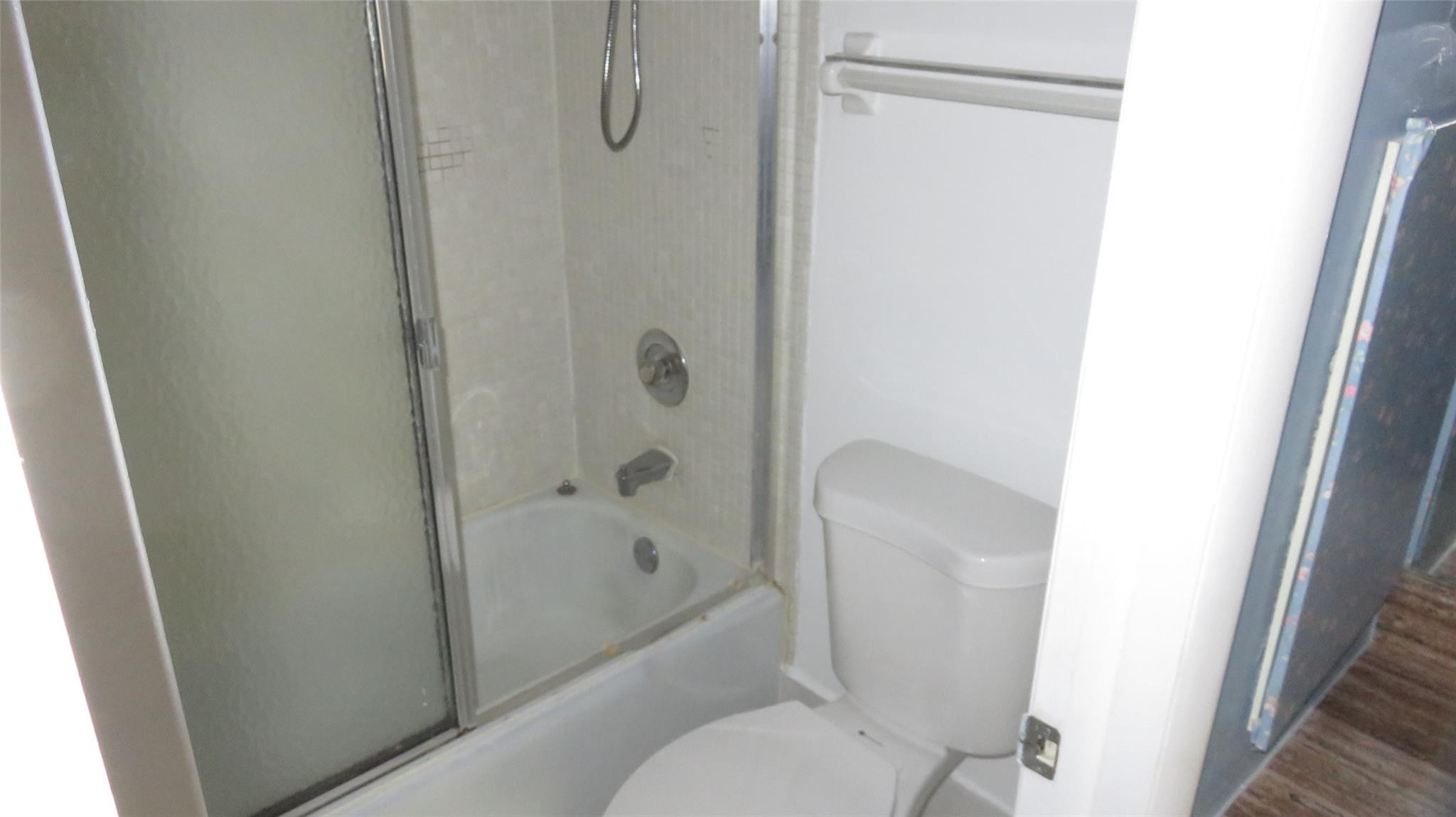3720 Inverrary Drive, Unit 2C Lauderhill, FL 33319 - Photo 24 of 42 a bathroom with a shower and a toilet