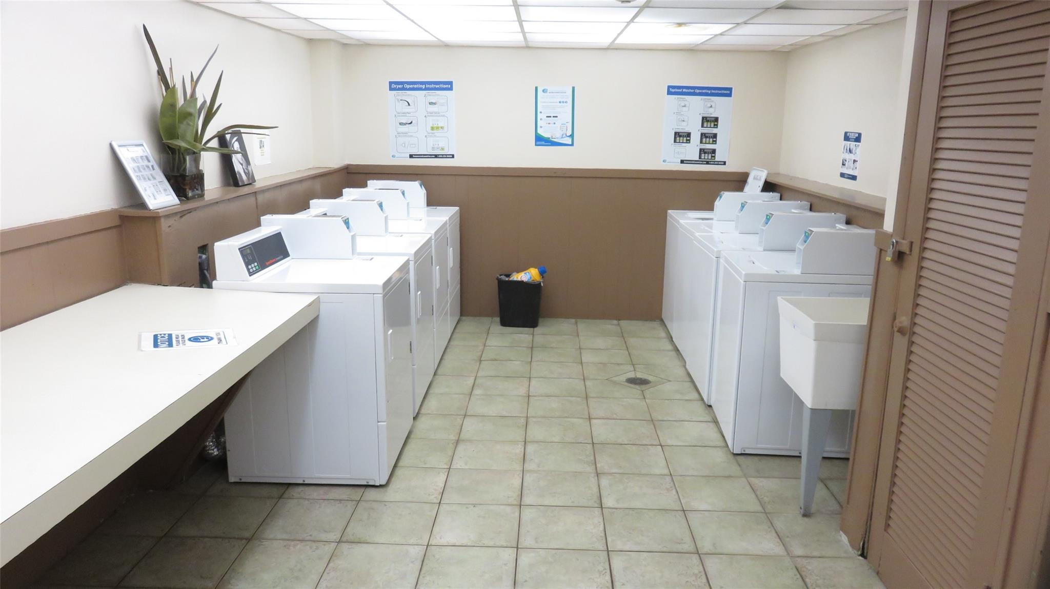 3720 Inverrary Drive, Unit 2C Lauderhill, FL 33319 - Photo 25 of 42 a room with a washing machine and sink