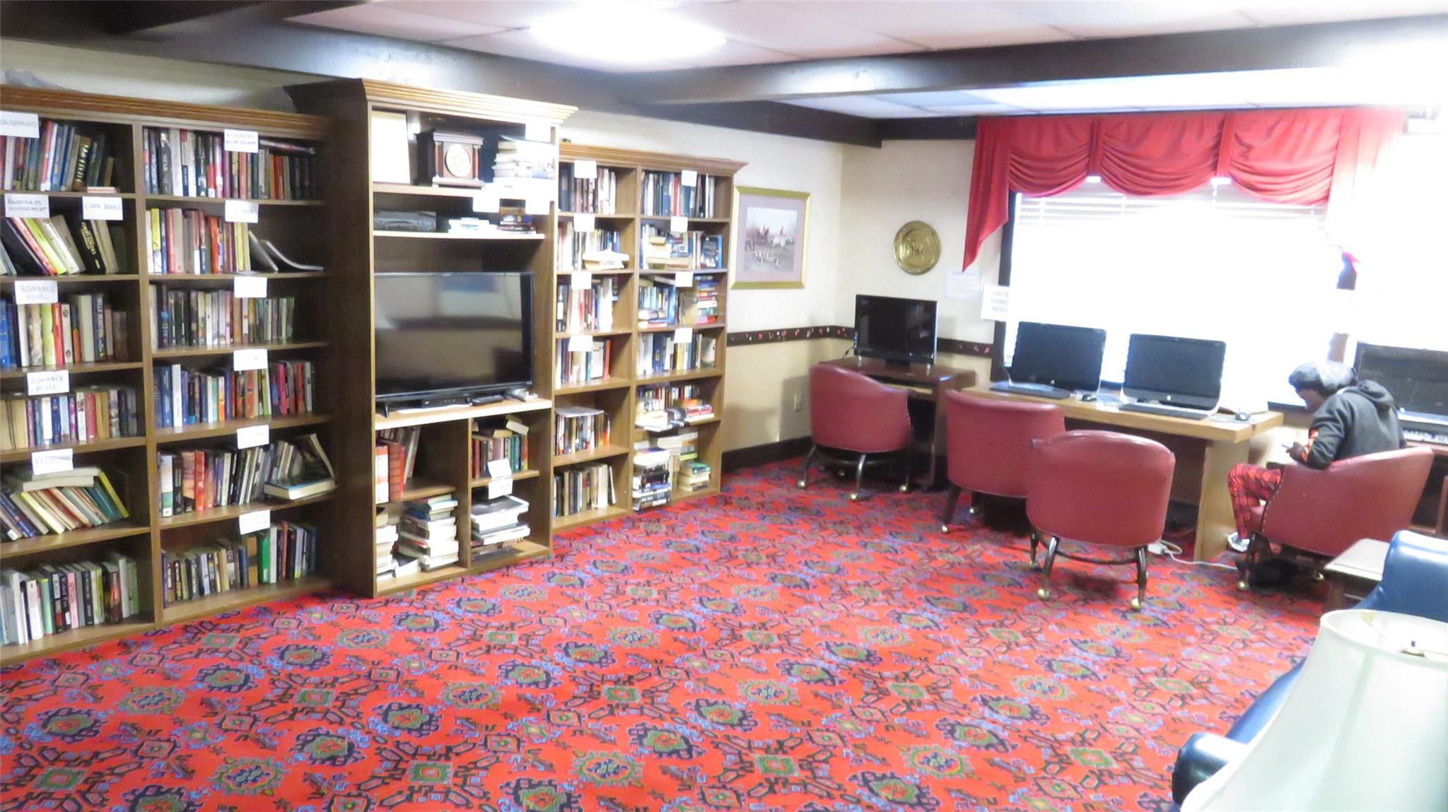 3720 Inverrary Drive, Unit 2C Lauderhill, FL 33319 - Photo 27 of 42 a workspace with a bookshelf