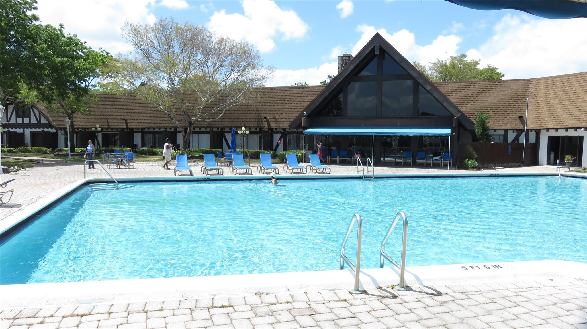 3720 Inverrary Drive, Unit 2C Lauderhill, FL 33319 - Photo 30 of 42 a swimming pool view with a outdoor seating