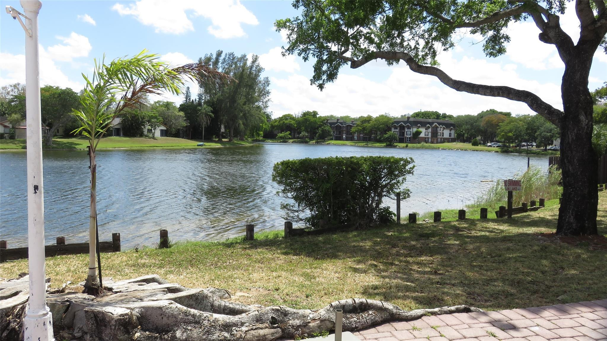 3720 Inverrary Drive, Unit 2C Lauderhill, FL 33319 - Photo 31 of 42 a view of a lake from a yard