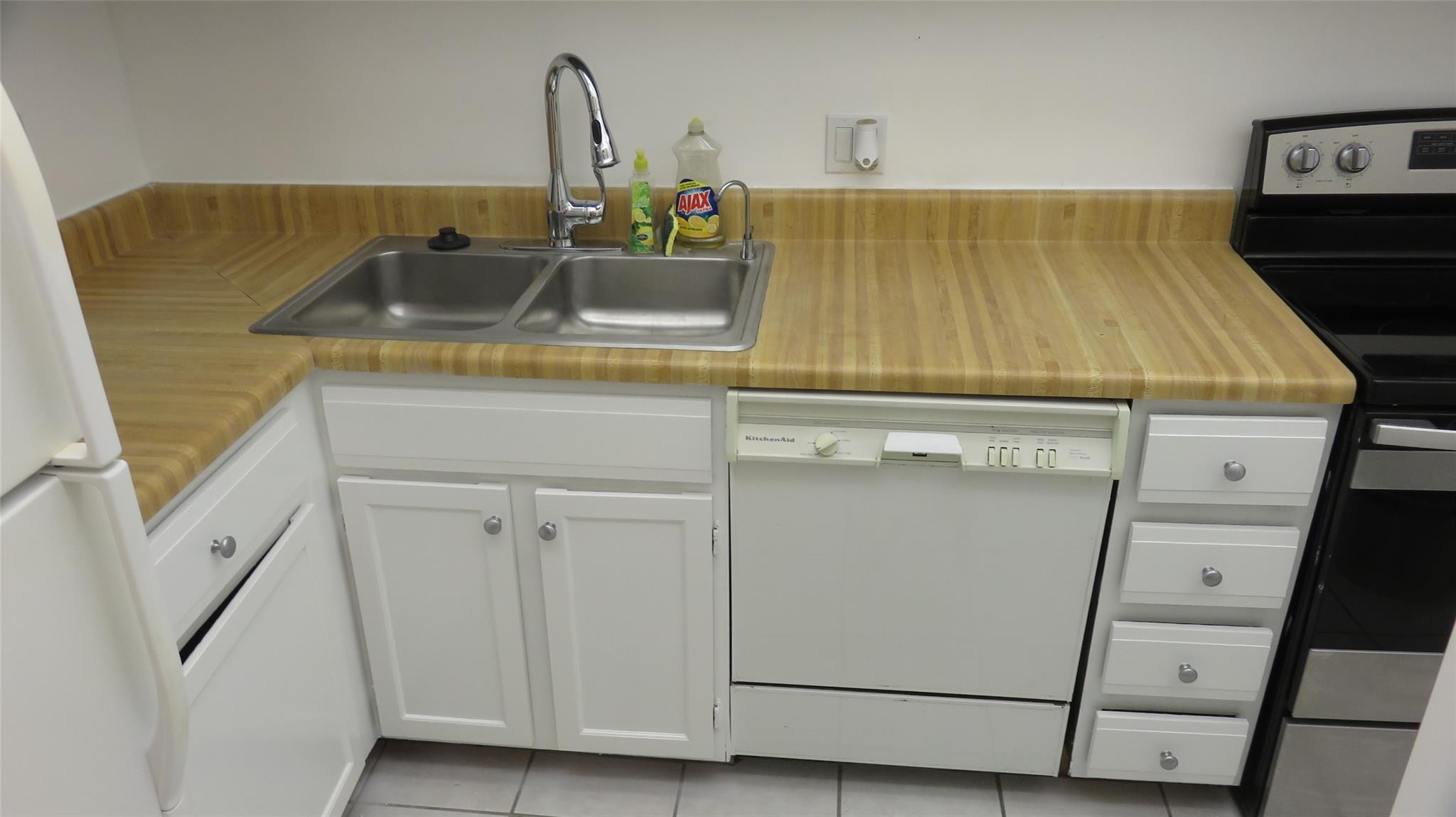 3720 Inverrary Drive, Unit 2C Lauderhill, FL 33319 - Photo 6 of 42 a bathroom with a sink and vanity