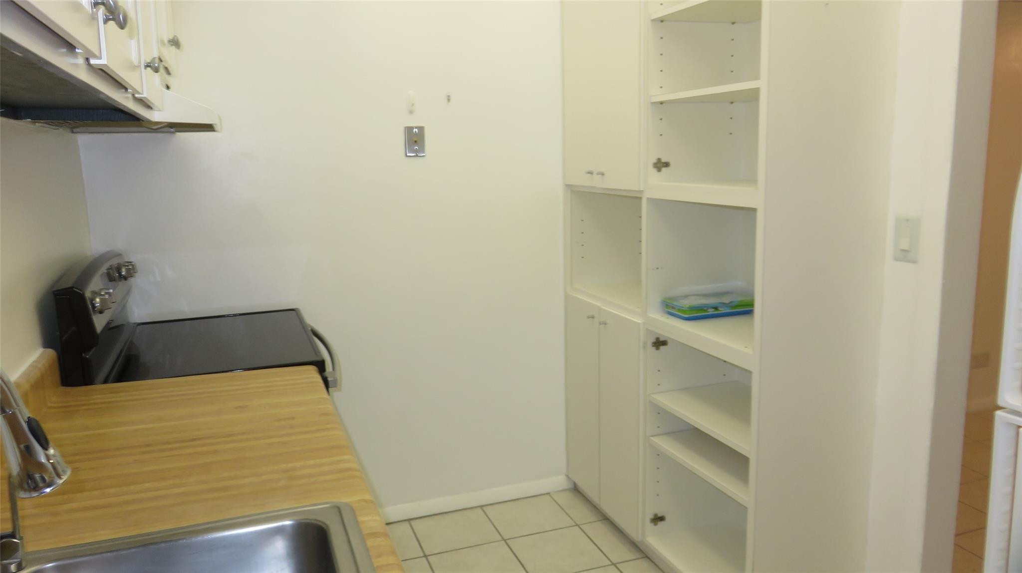 3720 Inverrary Drive, Unit 2C Lauderhill, FL 33319 - Photo 9 of 42 a bathroom with a bathtub