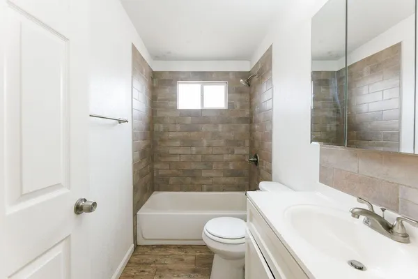 a bathroom with a sink toilet bathtub and shower