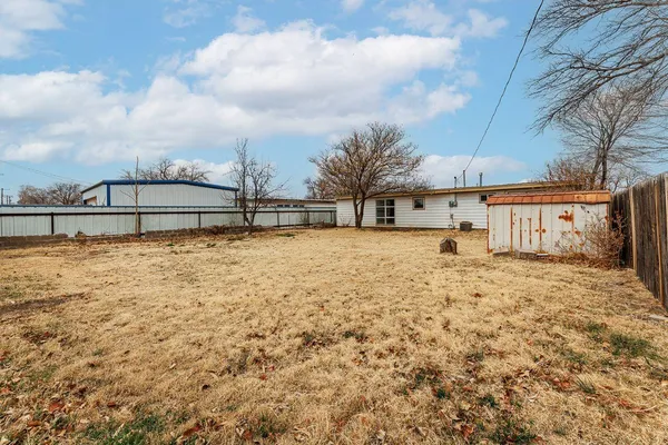 a view of a backyard of the house