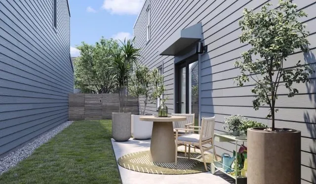 a view of a chair and table in backyard